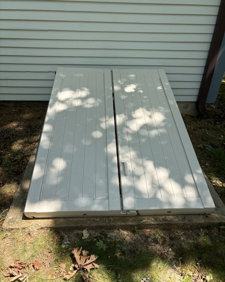 The same basement doors cleaned back to a uniform finish