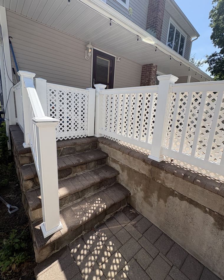 The same steps and lattice panel bright white after soft washing