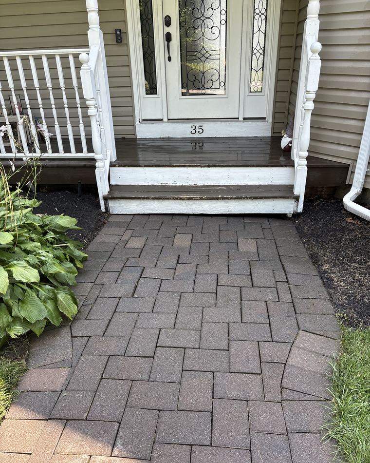 Paver walkway surface-cleaned to an even stone colour, joints clear of weeds